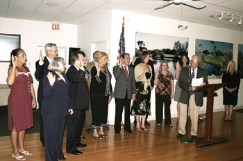 Manatee County Commissioner John Chappie swears in Chamber board members.