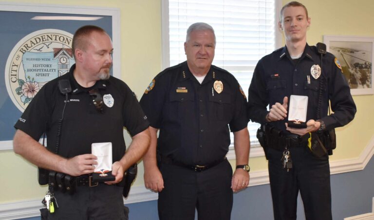 Police officers receive medals for saving a life