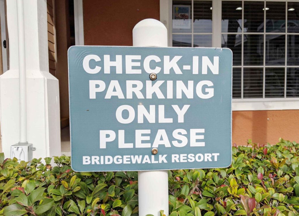 Three parking spaces along the 100 block of Bridge Start are reserved for customers of the BridgeWalk complex who check in.
