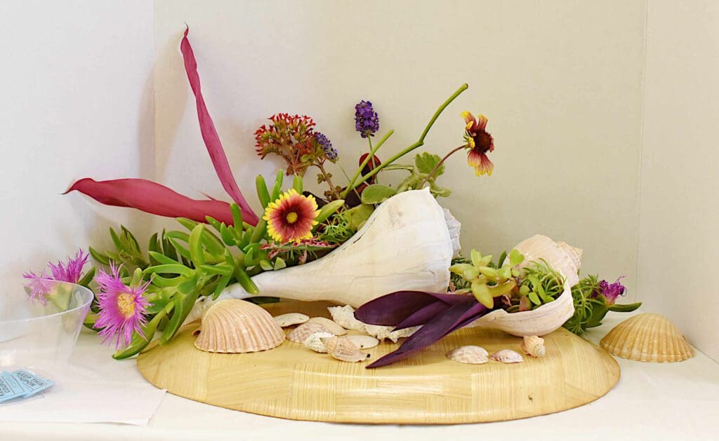 AMI Garden Club hosts Paradise Found flower show