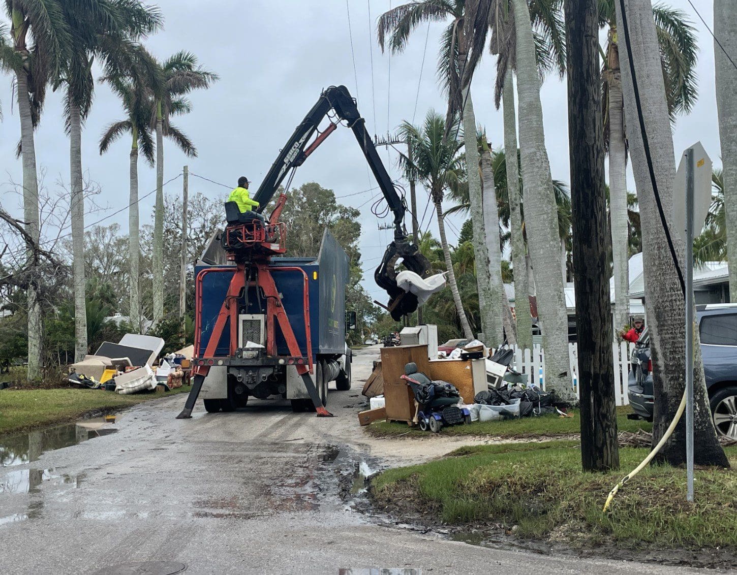 Mounds of debris remain as hurricane approaches